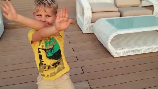 Laughing Kid Showing Victory Sign — Stock Video