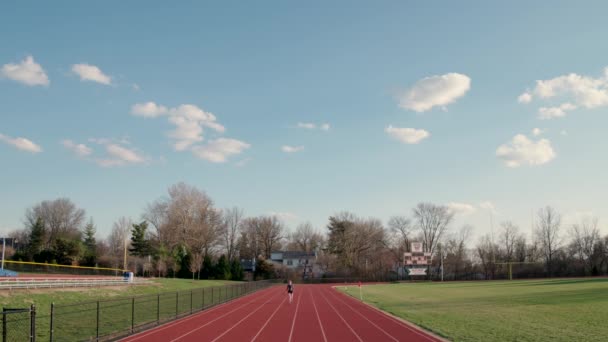 Aerial Teen Girl Warming High School Track — Stock Video