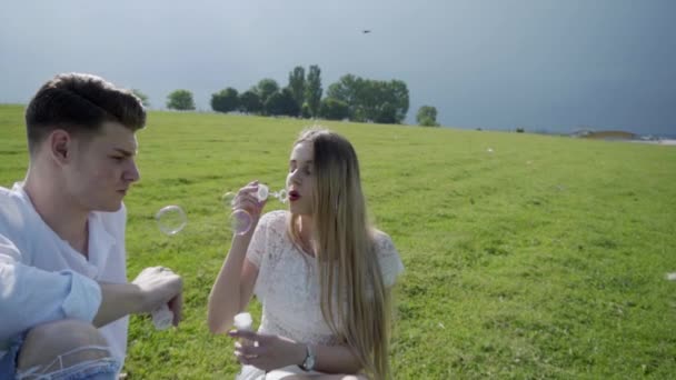 Love Couple Blowing Soap Bubbles — Stock Video