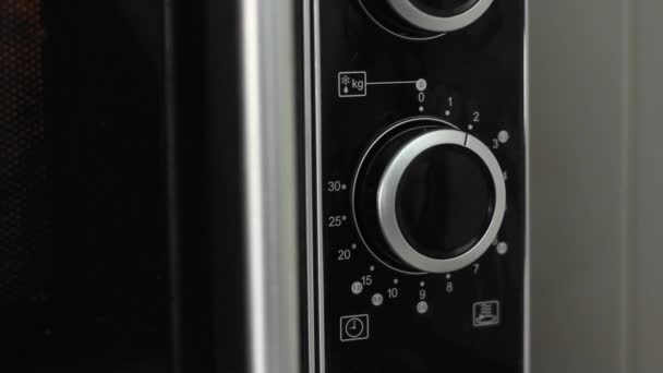 Setting Timer Microwave Letting Run While — Stock Video