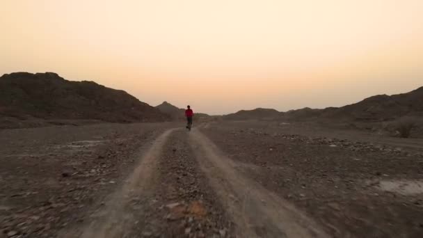 Young Teenager Riding Folding Bike Flat Road Terrain Mountains Fujairah — Stock Video