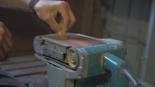 Sanding Anchor Bracelet Using Upturned Belt Sander — Stock Video