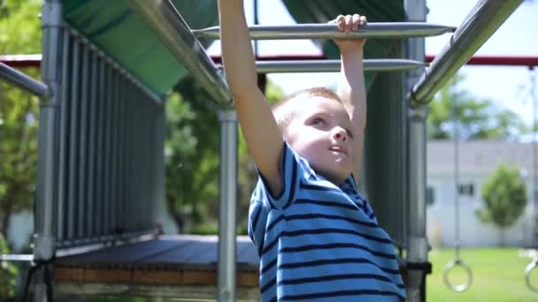 Slow Motion Shot Young Boy Playing Monkey Bars Playground Set — Stock Video