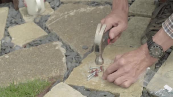Workman Hands Hammering Nails Nail Hook Cable Clip Concrete Floor — Stock Video