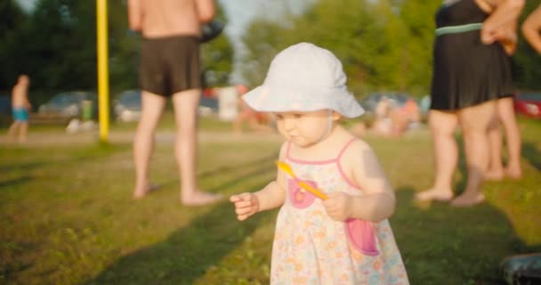 Cute Toddler Girl Walking Grassy Beach — Stock Video