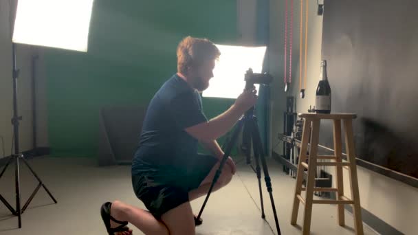 Photographer Studio Examining Back Camera Product Shot Static Tripod — Stock Video