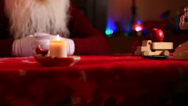 Burning Candle Santa Table Video Dolly Truck Right — Stock Video