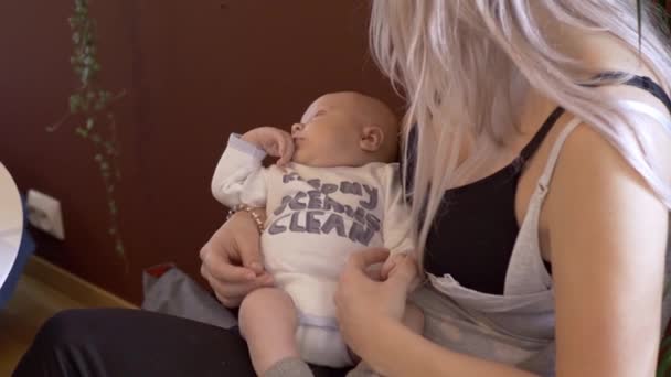 Mother Holding Newborn Baby Boy Comfortably Bonding Maternal Embrace — Stock Video