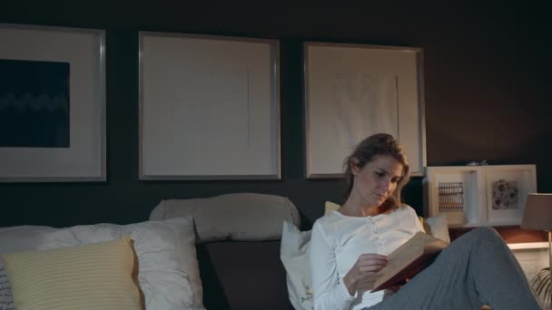 Wideshot Young Woman Laying Bed While Reading Book Studying Engaged — Stock Video