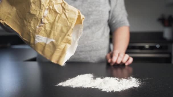 Close View Woman Pouring Flour Black Counter Brown Paper Sack — Stock Video