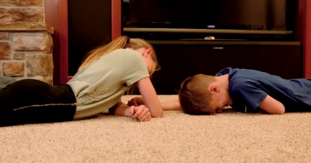 Siblings Arm Wrestle Each Other Floor — Stock Video