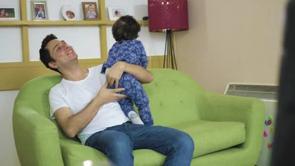 Father Plays Laughs His Toddler Son Living Room Sofa — Stock Video