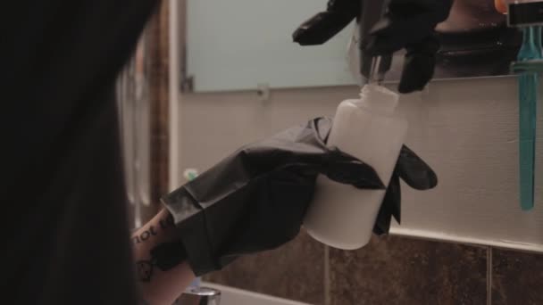 Person Black Hand Gloves Thoroughly Put Hair Bleach Powder Bottle — Stock Video