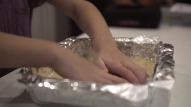 Young Girl Prepares Crust Baking Tray Making Millionaire Shortbread Cookies — Stock Video