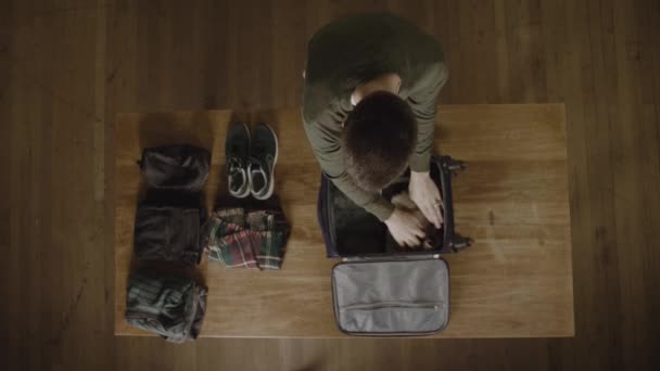 Young Man Packing His Carry Bag Last Minute Trip Overhead — Stock Video