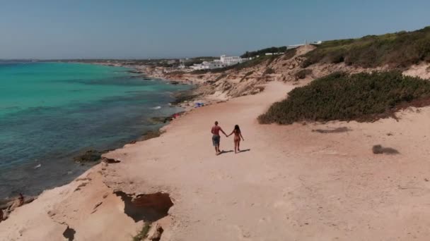 Drone Follows Romantic Couple Holding Hands Formentera Spain — Stock Video