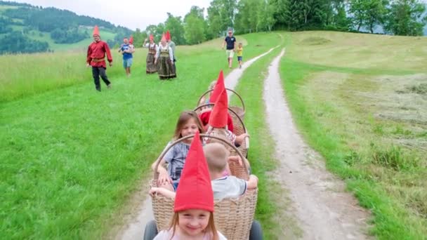 Children Wearing Red Dwarf Hats Basket Carriages Slovenj Gradec Slovenia — Stock Video