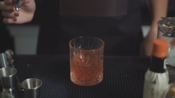 Mixologist Adds Cherry Garnish Whiskey Craft Cocktail Rocks Glass — Stock Video