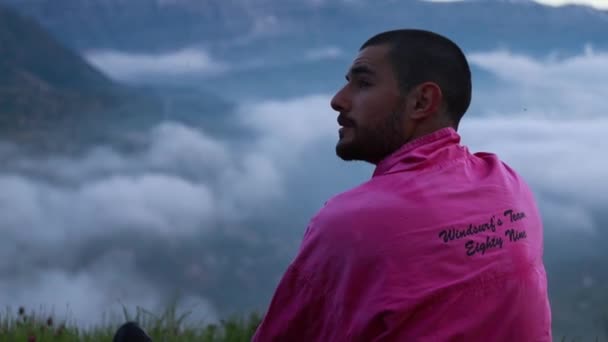 Middle Eastern Man Overlooking Misty Valley Looks Left Smiles — Stock Video