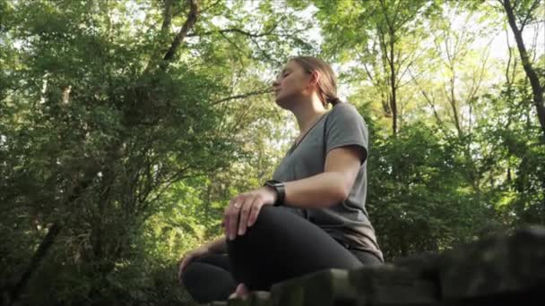 Camera Pushing Woman Sitting Meditating Old Bridge Middle Forest — Stock Video