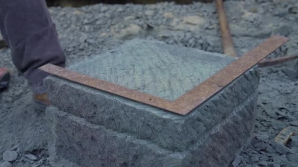 Handheld Shot Stone Craftsman Using Right Angle Tape Measure Mark — Stock Video
