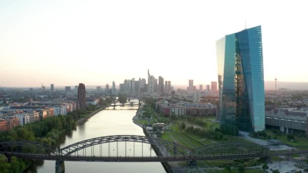 Aerial panorama drone shot European Central Bank Frankfurt Europische Zentralbank EZB ECB with fly to the skyline sunset.