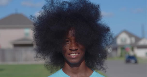 African American Adolescent Boy Huge Afro Looking Camera — Stock Video