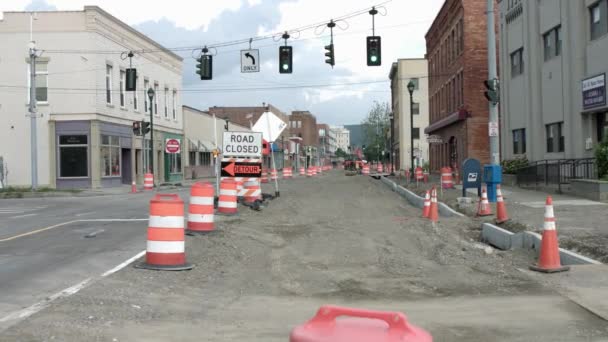 Road Construction With Plastic Barrel Barrier, Traffic Cone, Detour And Road Closed Sign At Daytime. - wide shot