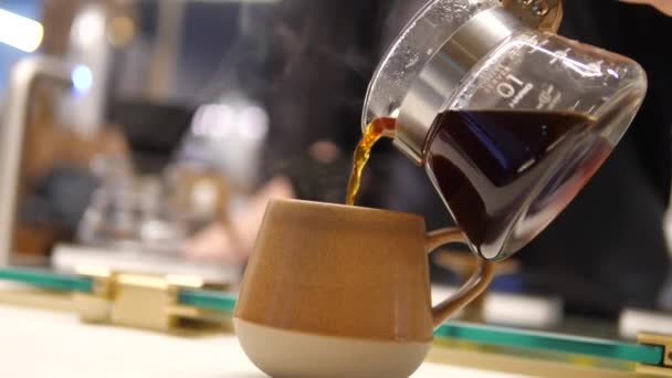 Man Takes Glass Carafe Containing Coffee Blurred Foreground Pours Yellow — Stock Video