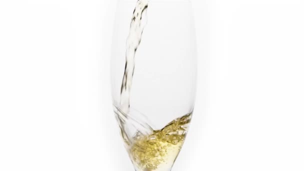 Mid shot of white wine poured in slowmotion in a glass
