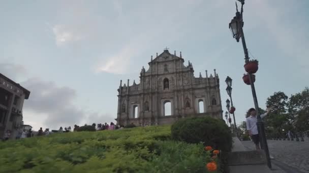 Macau - Ruins of St Paul Church with tourists on a bright summer evening