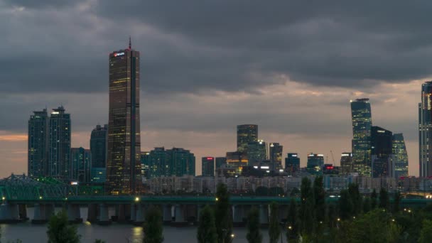 63 SQUARE Skyscraper At Yeouido Island With Hangang Railway Bridge In Foreground At Night In Seoul, South Korea. - timelapse