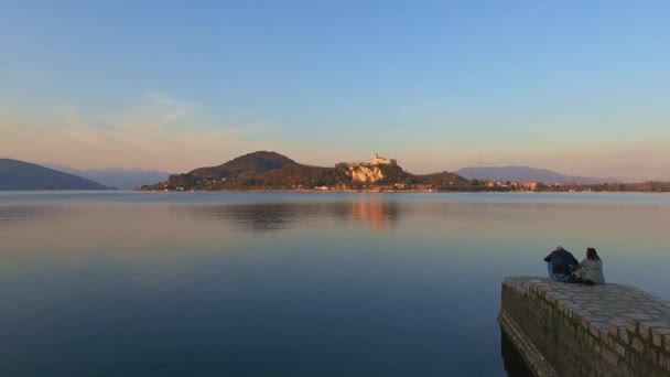 Romantic Couple Sit Jetty Edge Maggiore Lake Look Angera Castle — Stock Video