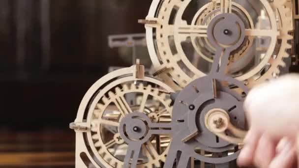 Close Hand Turning Hand Crank Wooden Cogwheel — Stock video