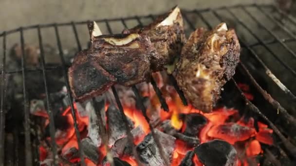 Close Up Of Delicious Steak Grilling Over Charcoal Fire.