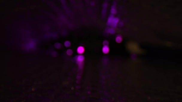 Defocused Pulsating Purple Led Lights Reflecting Top Bottom Reflective Car — Stock Video