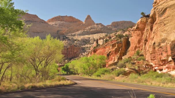 Highway 24 Through Capitol Reef National Park With Jeep Passing At Narrow Assphalt Road Near Torrey, Utah State, USA. - Statické