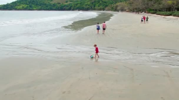 Aerial View Little Kid Playing Football Beach Drone Rotating Little — Stock Video