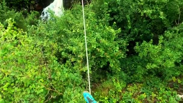 Pov Shot Men Balancing Steel Cable Bridge Green Trees Wild — Stock Video