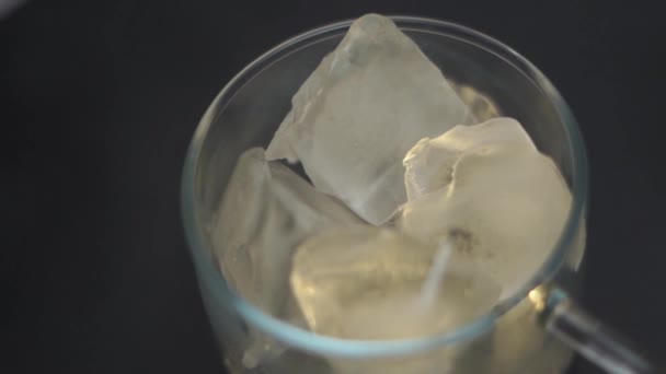 Coffee Falling Transparent Glass Cup Full Ice — Stock Video