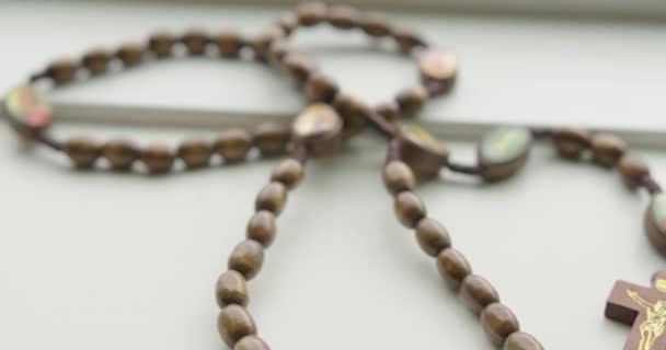 Close Tilt Pan Right Wooden Rosary Beads — Stock Video