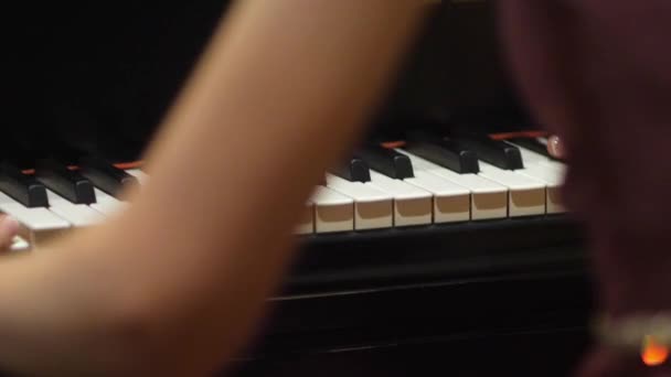 Woman playing the piano hands and keys