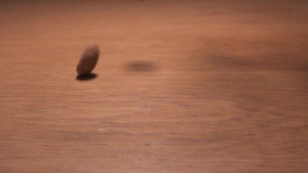 Dutch Pepernoten Falling Slow Motion Wooden Table — Stock Video