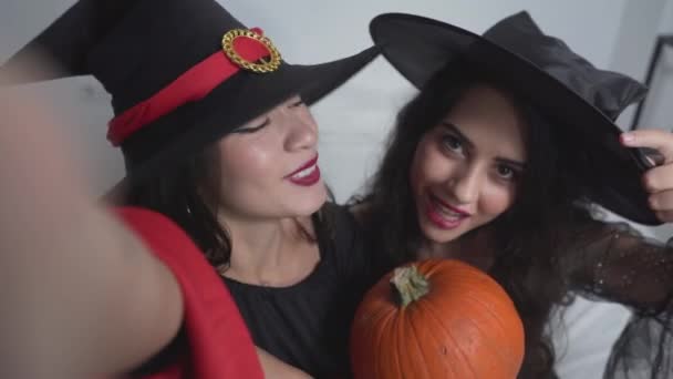 Portrait Two Charming Colombian Girls Dressed Witch Costumes Pumpkin Taking — Stock Video