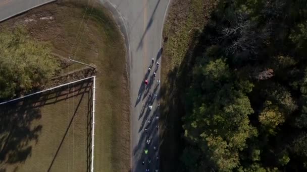 Drone Aerial Turn Bicycle Riders Rounding Curve — Stock Video