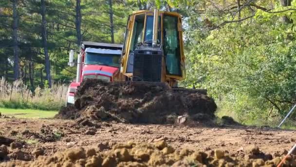 Low Angle View John Deere 560H Lgp Bulldozer Pushing Dirt — Stock Video