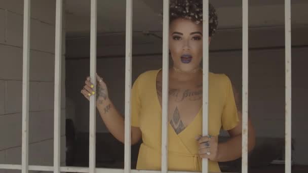 Latin Woman Visible Tattoos Sensual Lips Swaying Prison Bars Zoom — Stock Video