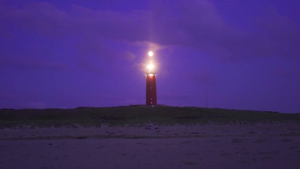 Large Red Metal Lighthouse Located Coast Illuminated Warning Any Vessel — Stock Video