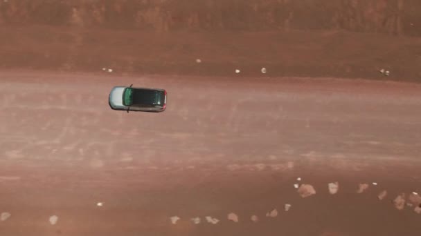 Car Driving Gravel Road Red Volcanic Desert Aerial Drone — Stock Video