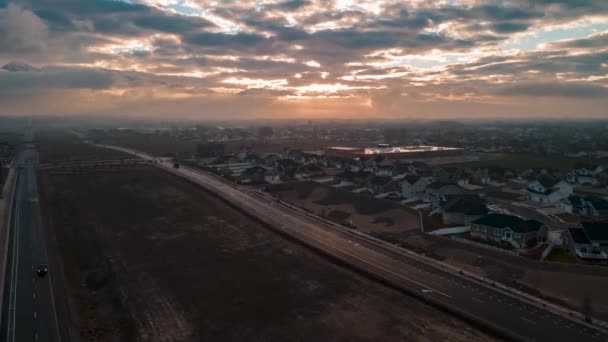 Fog and an overcast sky subdue the sunrise in this American suburb - aerial hyper lapse
